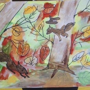 Семья белок в осеннем лесу