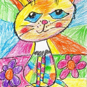 Мой любимец,котенок, на цветастом коврике.