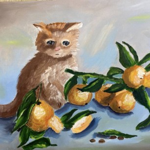 Котенок в апельсинах