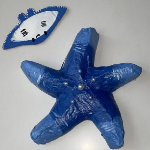 На мелководье.