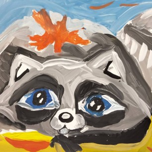 Енот под опавшим листом