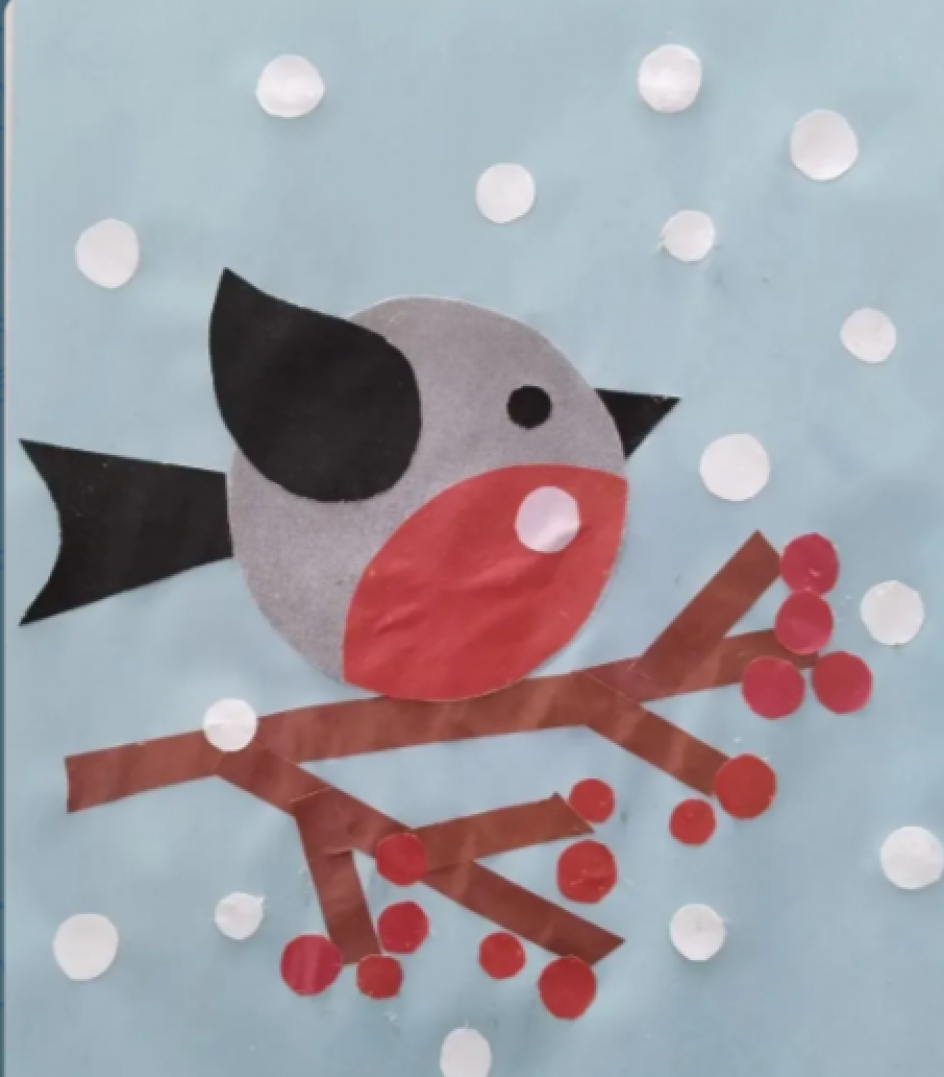 Снегирь на ветке рябины