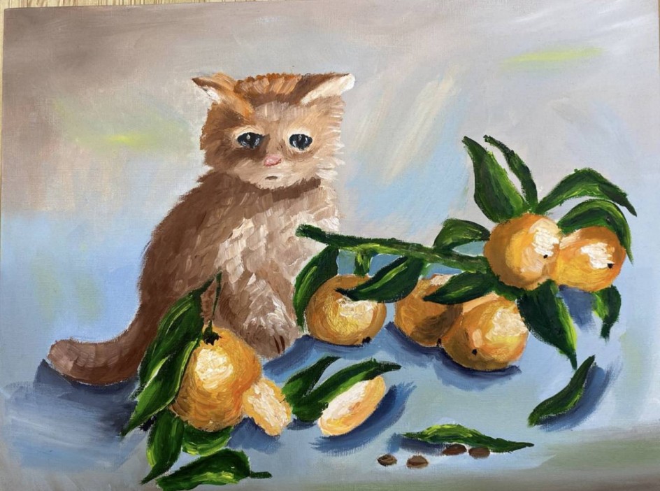 Котенок в апельсинах