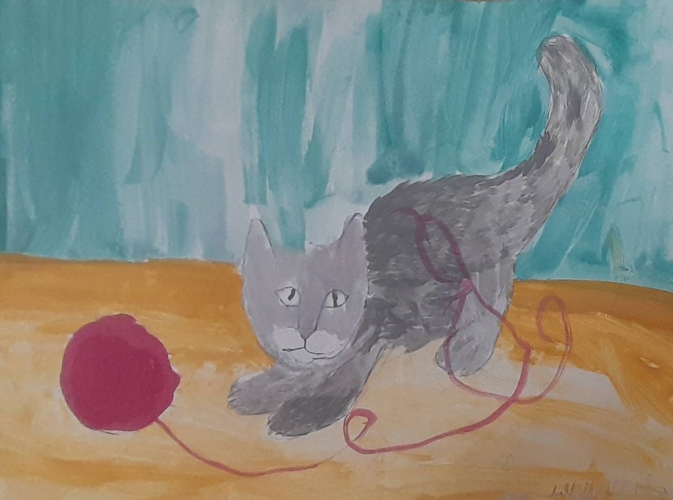 Котенок возится с клубком